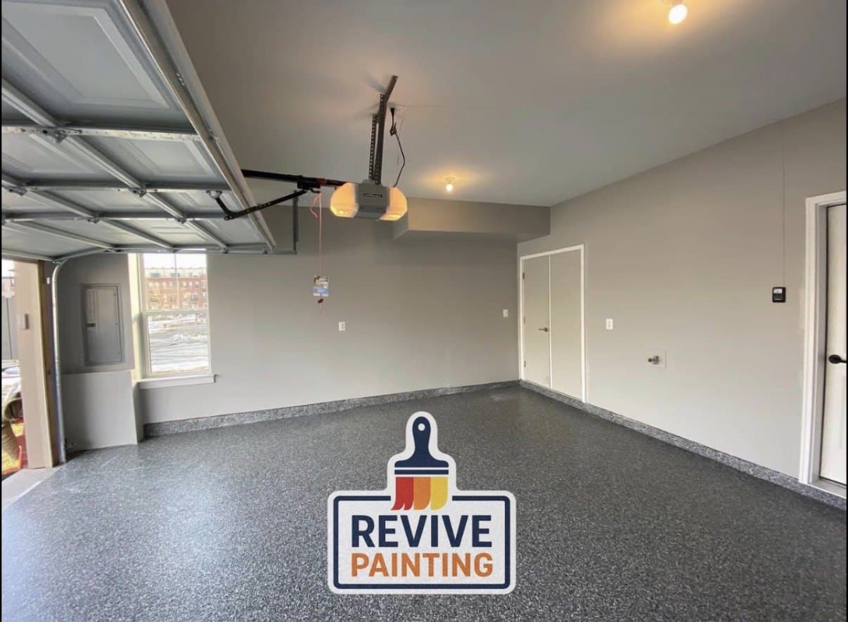 A garage interior with freshly painted walls, ceiling and doors