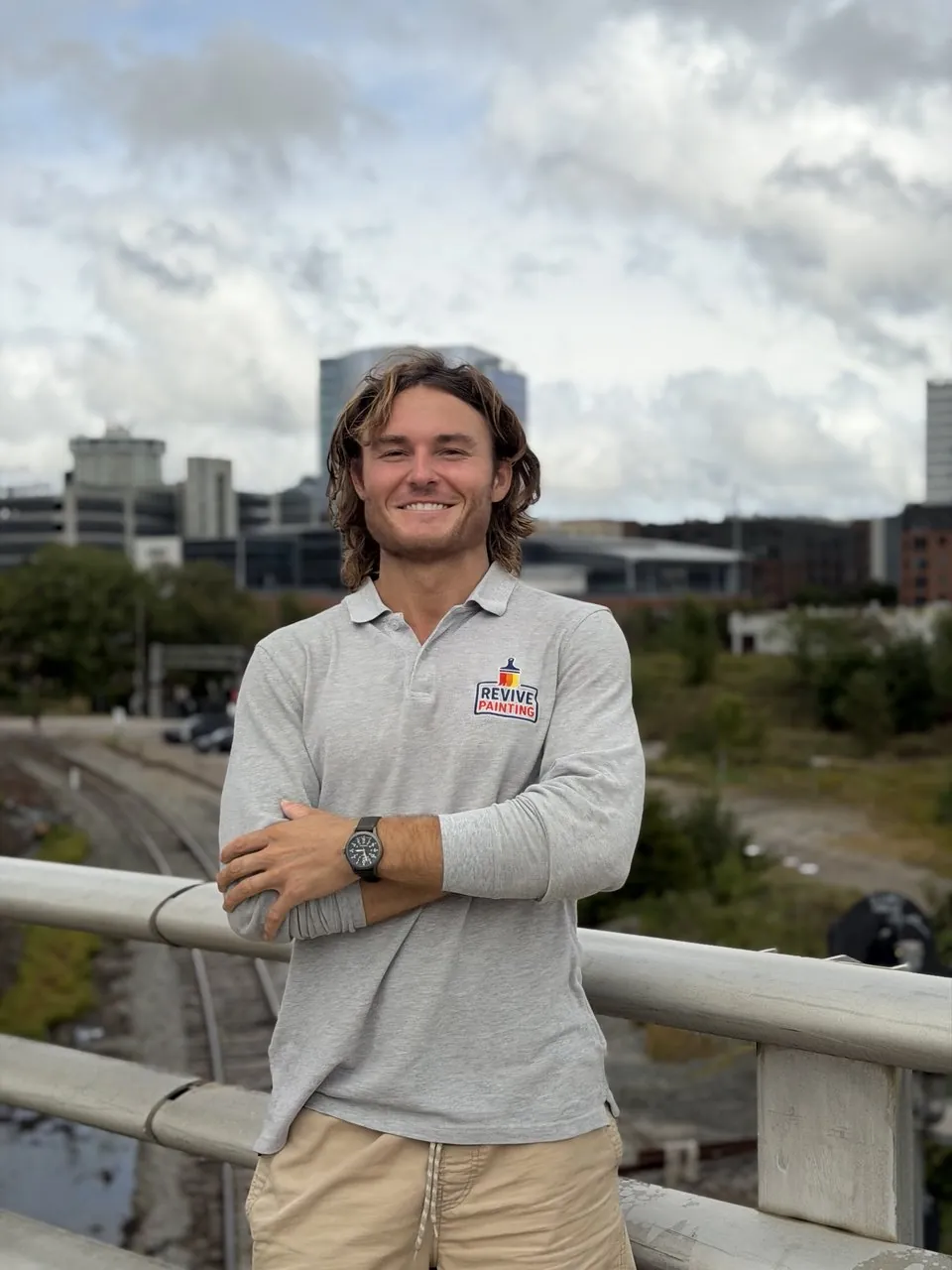 Carter Rosenkrans, owner of Revive Painting, in a Revive Painting polo in downtown Raleigh